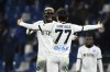 Napoli's Khvicha Kvaratskhelia celebrates with Victor Osimhen after scoring his team fifth goal during the Serie A soccer match between Sassuolo and Napoli at Mapei Stadium, Reggio Emilia, Italy, Wednesday Feb. 28, 2024. (Massimo Paolone/LaPresse via AP)