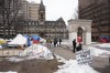 Volunteers clean up and check on residents remaining at the homeless encampment in Grand Parade in front of city hall in Halifax on Monday, February 26, 2024. The City of Halifax says it will cut electricity off to two homeless encampments by the end of this week in the latest step in its eviction efforts.THE CANADIAN PRESS/Darren Calabrese