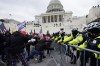 FILE - Rioters loyal to President Donald Trump rally at the U.S. Capitol in Washington on Jan. 6, 2021. The Supreme Court agreed on Feb. 28, 2024, to decide whether former President Donald Trump can be prosecuted on charges he interfered with the 2020 election and has set a course for a quick resolution. (AP Photo/Julio Cortez, File)