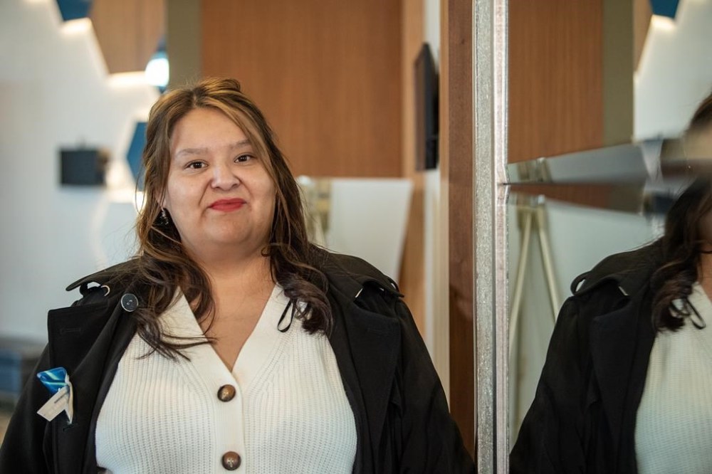 Vanessa Burns, who had been in a domestic partnership with Myles Sanderson for 14 years, stands for a photograph during an afternoon break at the inquest into the apprehension and death of Myles Sanderson, who killed 11 people and injured 17 others on James Smith Cree Nation and the nearby community of Weldon back in September 2022, held at a hotel conference room in Saskatoon, Wednesday, Feb. 28, 2024. THE CANADIAN PRESS/Liam Richards
