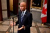 Minister of International Development Ahmed Hussen speaks in the foyer of the House of Commons before Question Period on Parliament Hill in Ottawa, Thursday, Feb. 15, 2024. Hussen's office says Canada is working to airdrop humanitarian aid to the Gaza Strip as soon as possible. THE CANADIAN PRESS/Justin Tang