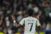 FILE - Real Madrid's Vinicius Junior celebrates after scoring his side's second goal during the Champions League Group C soccer match between Real Madrid and Braga at the Santiago Bernabeu stadium in Madrid, Spain, Wednesday, Nov. 8, 2023. Spanish police have arrested an Atletico Madrid fan for using racist language and death threats to terrorize an eight-year-old girl who was wearing a shirt of Real Madrid player Vinícius Júnior. (AP Photo/Jose Breton, File)