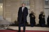 PSG's Kylian Mbappe poses as he arrives for a state dinner with French President Emmanuel Macron, and Qatar's Emir Sheikh Tamim bin Hamad Al Thani at the Elysee Palace in Paris, Tuesday, Feb. 27, 2024. Qatar's emir has arrived in France for a two-day state visit as his country plays a key role in ongoing diplomatic efforts to achieve a cease-fire in Gaza and the release of hostages. (AP Photo/Thibault Camus)