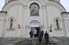 People exit the Church of the Icon of the Mother of God 