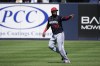 Minnesota Twins first baseman Carlos Santana runs on the field before a spring training baseball game against the New York Yankees Monday, Feb. 26, 2024, in Tampa, Fla. (AP Photo/Charlie Neibergall)