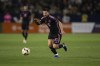 Inter Miami forward Lionel Messi (10) dribbles the ball during the second half of an MLS soccer match against the Los Angeles Galaxy, Sunday, Feb. 25, 2024, in Carson, Calif. (AP Photo/Kyusung Gong)