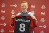 Newly-signed Toronto FC midfielder Matty Longstaff holds up his jersey after training in Toronto on Friday, March 1, 2024. THE CANADIAN PRESS/Neil Davidson