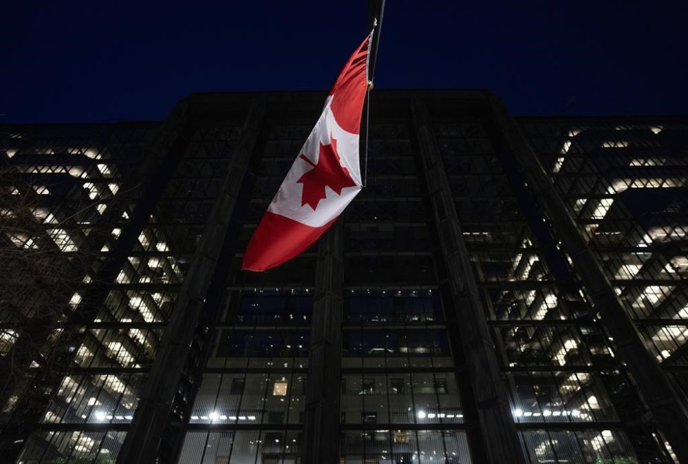 The Bank of Canada is expected to preach patience at its interest rate announcement this week as economists say weakening economic conditions are setting the stage for rate cuts in the coming months. The Bank of Canada is seen at night, Wednesday, February 21, 2024 in Ottawa. THE CANADIAN PRESS/Adrian Wyld