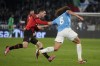 AC Milan's Christian Pulisic, left, stops Lazio's Matteo Guendouzi during the Italian Serie A soccer match between Lazio and Milan at Rome's Olympic stadium, Friday, March 1, 2024. (AP Photo/Gregorio Borgia)