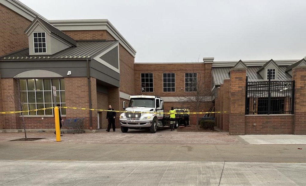 Crews work to remove a vehicle that had crashed into a Walmart store in Canton Township, Mich., on Friday, March 1, 2024. A sport-utility vehicle crashed into a Walmart in suburban Detroit, injuring several people Friday afternoon, police said. (AP Photo/Mike Householder)