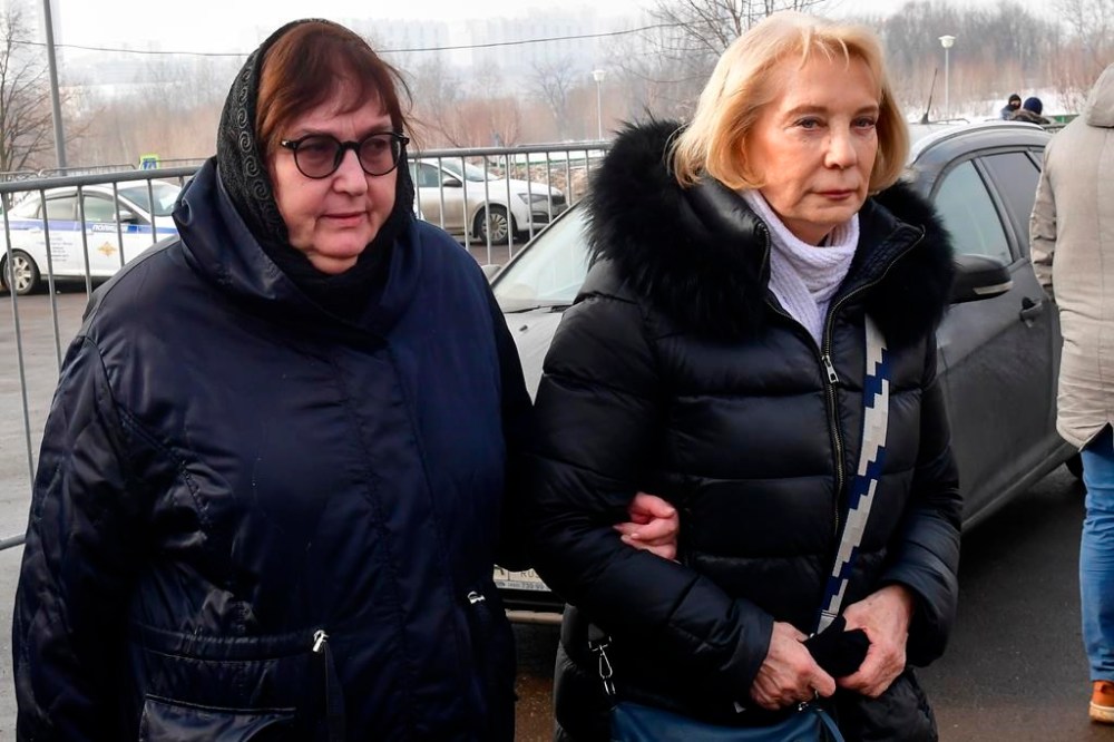 Russian opposition leader Alexei Navalny's mother, Lyudmila Navalnaya, left, and his mother-in-law, no name available, arrive to visit the grave of Alexei Navalny after his funeral yesterday at the Borisovskoye Cemetery, in Moscow, Russia, on Saturday, March 2, 2024. Navalny, who was President Vladimir Putin's fiercest foe, was buried after a funeral that drew thousands of mourners amid a heavy police presence. (AP Photo)