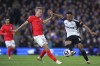 Fulham's Rodrigo Muniz, right, and Brighton and Hove Albion's Jan Paul van Hecke battle for the ball during the English Premier League soccer match between Brighton and Hove Albion and Fulham at Craven Cottage, London, Saturday March 2, 2024. (Adam Davy/PA via AP)