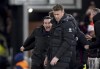 Aston Villa manager Unai Emery, left, celebrates after his side scored their third goal during the English Premier League soccer match between Luton Town and Aston Villa at Kenilworth Road Stadium in Luton, England, Saturday, March 2, 2024. (Bradley Collyer/PA via AP)