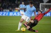 Lazio's Luca Pellegrini, left, and AC Milan's Christian Pulisic vie for the ball during the Italian Serie A soccer match between Lazio and Milan at Rome's Olympic stadium, Friday, March 1, 2024. (AP Photo/Gregorio Borgia)