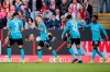 Leverkusen's Leverkusen's Alejandro Grimaldo, second left, celebrates after scoring his side's second goal during the Bundesliga soccer match between 1. FC Cologne and Bayer 04 Leverkusen in Cologne, Germany, Sunday, March 3, 2024. (Rolf Vennenbernd/dpa via AP)