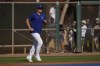 Los Angeles Dodgers' Shohei Ohtani jogs on to a practice field as he arrives for spring training baseball workouts at Camelback Ranch in Phoenix, Sunday, March 3, 2024. (AP Photo/Carolyn Kaster)