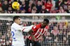 Barcelona's Joao Cancelo, left, duels for the ball with Athletic Bilbao's Inaki Williams during a Spanish La Liga soccer match between Athletic Bilbao and Barcelona at the San Mames stadium in Bilbao, Spain, on Sunday, March 3, 2024. (AP Photo/Alvaro Barrientos)