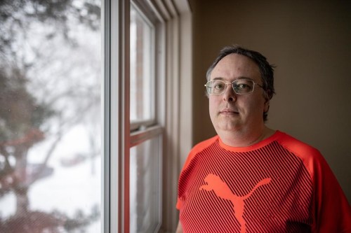 Alan Holman, who is on low income and relies on the carbon rebate to make ends meet, stands for a photograph in his apartment in Saskatoon, Saturday, March 2, 2024. Ottawa says it's no longer going to send carbon rebates to Saskatchewan after Premier Scott Moe announced the province won't remit the levy on natural gas. THE CANADIAN PRESS/Liam Richards