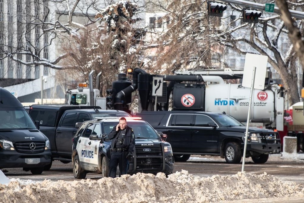 Police investigate gunfire at Edmonton City Hall on Tuesday, Jan. 23, 2024. RCMP have laid terrorism charges against a man accused of firing a gun and igniting a Molotov cocktail in the building. THE CANADIAN PRESS/Jason Franson