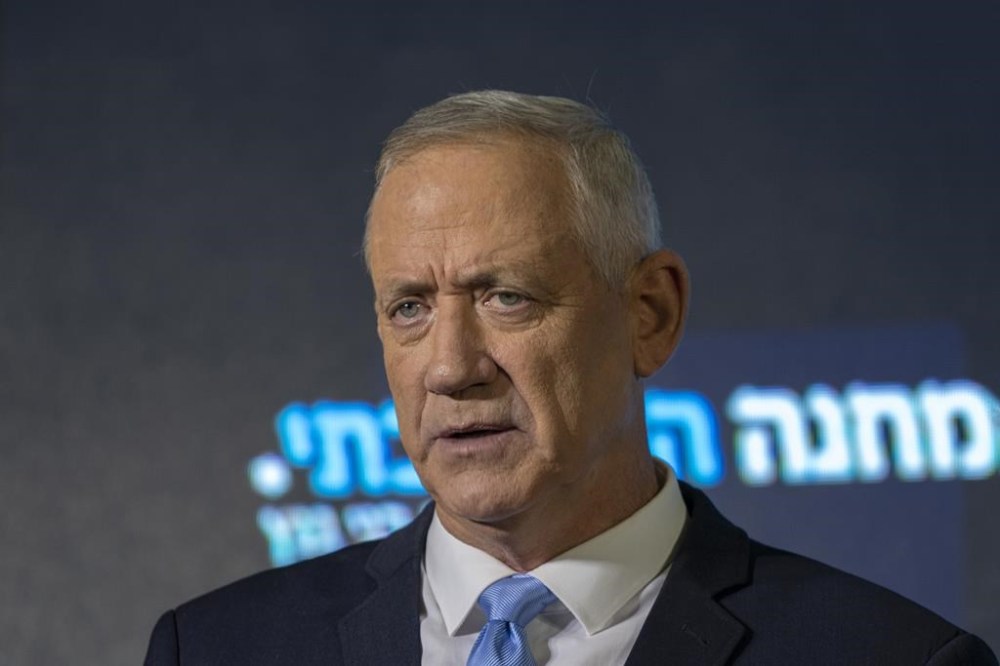 FILE - Benny Gantz speaks at the announcement of former IDF chief Gadi Eisenkot's election bid in Ramat Gan, Israel, on Aug. 14, 2022. Gantz, Eisenkot and Gideon Sa'ar have teamed up for the November elections, called the National Unity Party. Benny Gantz, who is in Washington this week for meetings with U.S. leaders, is a crucial member of Israel’s War Cabinet. He is also the top political rival to Israeli Prime Minister Benjamin Netanyahu. Gantz is a centrist politician who joined Netanyahu’s ultranationalist and religious government soon after Hamas’ Oct. 7 attack on southern Israel. (AP Photo/Tsafrir Abayov, File)