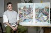 French artist Hugo Gattoni poses next to the Paris 2024 Olympic and Paralympic posters at his workshop, in Ivry-sur-Seine, outside Paris, Tuesday Feb. 20, 2024. Vibrant colors and striking landmarks illuminate posters for the Paris Olympic Games in an Art Deco style inspired by the city's flamboyant past. The posters have been unveiled at the Musée d'Orsay. (AP Photo/Thomas Padilla)