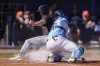 Detroit Tigers Andre Lipcius beats the tag at the plate by Tampa Bay Rays catcher Alex Jackson to score on an RBI single by Justice Biggie in the third inning of a spring training baseball game in Port Charlotte, Fla., Sunday, Feb. 25, 2024. (AP Photo/Gerald Herbert)
