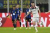 Genoa's Johan Vasquez celebrates after scoring against Inter Milan during a Serie A soccer match between Inter Milan and Genoa at the San Siro stadium in Milan, Italy, Monday, March 4, 2024. (AP Photo/Luca Bruno)