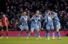 Aston Villa's Lucas Digne, right, is congratulated by his team mates after scoring his sides third goal during the English Premier League soccer match between Luton Town and Aston Villa at Kenilworth Road Stadium in Luton, England, Saturday, March 2, 2024. (Bradley Collyer/PA via AP)