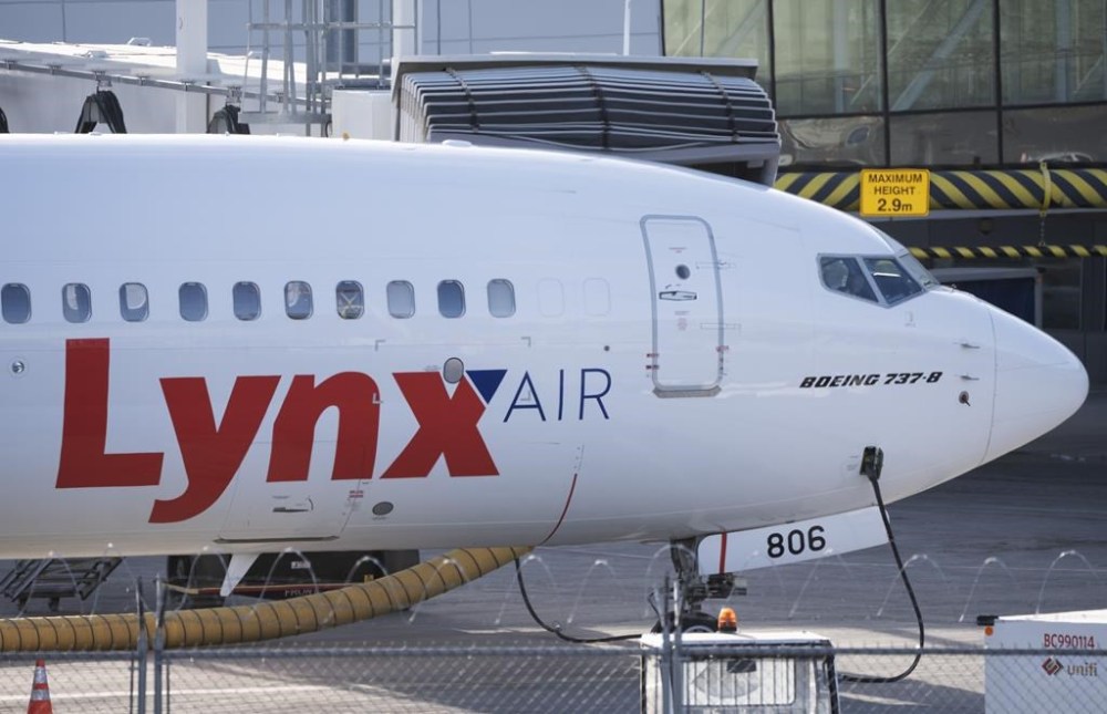 A Lynx Air Boeing 737 jet sits at a gate at the international airport in Calgary on Friday, February 23, 2024. Flair Airlines CEO Stephen Jones says he still hopes to add several Lynx Air planes to his fleet, even after their tentative merger deal fell through due to Lynx's shutdown last month.THE CANADIAN PRESS/Todd Korol