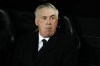 Real Madrid's head coach Carlo Ancelotti takes his seat on the bench ahead of the La Liga soccer match between Valencia and Real Madrid at the Mestalla Stadium in Valencia, Spain, Saturday, March 2, 2024. (AP Photo/Jose Breton)