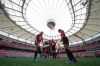 Youth soccer players kick a ball around on the field at B.C. Place stadium during a gathering to watch Vancouver be chosen as one of the host cities for the 2026 FIFA World Cup, in Vancouver, on Thursday, June 16, 2022.The city of Vancouver says it's unable to give a complete estimate of costs associated with hosting 2026 FIFA World Cup matches, due to hosting two more games than originally anticipated.THE CANADIAN PRESS/Darryl Dyck