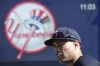 New York Yankees outfielder Giancarlo Stanton stands on the field before a spring training baseball game against the Minnesota Twins Monday, Feb. 26, 2024, in Tampa, Fla. (AP Photo/Charlie Neibergall)