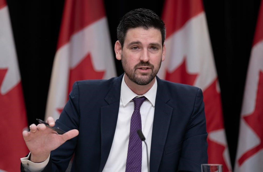 Minister of Housing, Infrastructure and Communities Sean Fraser responds to a question during a weekly news conference, Tuesday, Feb. 27, 2024 in Ottawa. Fraser announced almost $25 million Tuesday to build homes in Alberta while urging provincial governments to get creative about getting even more off the ground. THE CANADIAN PRESS/Adrian Wyld