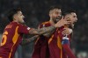 Roma's Lorenzo Pellegrini, right, celebrates after he scored his side's first goal during the Europa League play-off second leg soccer match between Roma and Feyenoord at Rome's Olympic stadium, Thursday, Feb. 22, 2024 (AP Photo/Alessandra Tarantino)