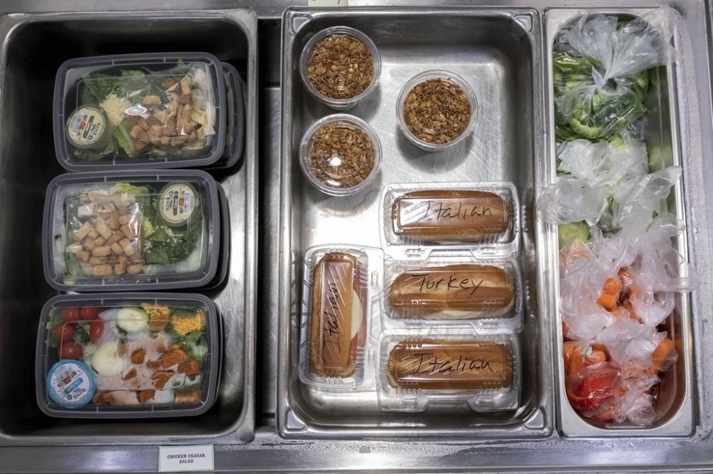 A sample of food items available during lunch break are shown at Tonalea K-8 school in Scottsdale, Ariz., Dec. 12, 2022. The New Democrats say they are pushing for the Liberal government to fund a national school food program in the upcoming budget. THE CANADIAN PRESS/AP-Alberto Mariani