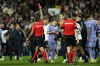 Referee Gil Manzano gives a red card to Real Madrid's Jude Bellingham after the La Liga soccer match between Valencia and Real Madrid at the Mestalla Stadium in Valencia, Spain, Saturday, March 2, 2024. (AP Photo/Jose Breton)