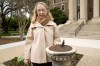 Alexis McCrossen poses for a photo by a sun dial on the campus of Southern Methodist University in Dallas, Wednesday, Feb. 28, 2024. McCrossen, a history professor at SMU, has written books on marking time. (AP Photo/Tony Gutierrez)