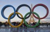 FILE - The Olympic rings are set up at Trocadero plaza that overlooks the Eiffel Tower in Paris on Sept. 14, 2017. A major French union is warning of possible strikes in the public sector, including at hospitals, during the Paris Olympics. The general secretary of the CGT tells France Info media that the union will give notice of a possible strike in public services during the Games, which are held in July-August. (AP Photo/Michel Euler, File)