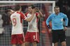 Bayern's Harry Kane, left, and Bayern's Leon Goretzka celebrate at the end of the Champions League round of 16 second leg soccer match between FC Bayern Munich and Lazio at the Allianz Arena stadium in Munich, Germany, Tuesday, March 5, 2024. Bayern Munich won 3-0. (AP Photo/Matthias Schrader)