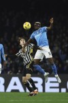 Napoli's Victor Osimhen, right, and Juventus' Fabio Miretti vie for the ball during the Serie A soccer match between Napoli and Juventus at the Diego Armando Maradona stadium in Naples, Italy, Sunday, March 3, 2024. (Alessandro Garofalo/LaPresse via AP)
