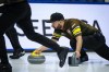 Manitoba-Carruthers third Reid Carruthers delivers a rock while playing Yukon during the Brier, in Regina, Thursday, March 7, 2024. THE CANADIAN PRESS/Darryl Dyck