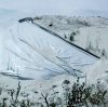 Tangi Bell, with Our Line in the Sand, shows photos of uncovered sand piles in Anola on March 24, 2023. (Mikaela MacKenzie / Winnipeg Free Press files)