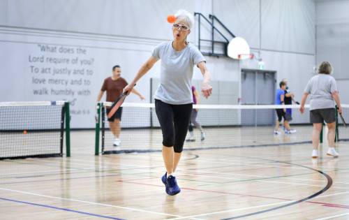 RUTH BONNEVILLE / WINNIPEG FREE PRESS SPORTS   Louise Vermette races to return the ball sent to the back of the court during game of pickleball in the newly built indoor pickleball court at Selkirk Community Church, near Selkirk Wednesday.