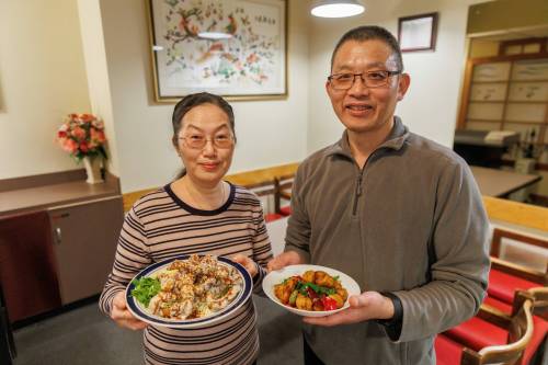 MIKE DEAL / WINNIPEG FREE PRESS
                                Chef Gloria Chuang (holding the Crispy Black Mushroom) and her husband and co-owner, Joseph Chen (with Spicy Gluten), have run Affinity Vegetarian Garden since 2002.