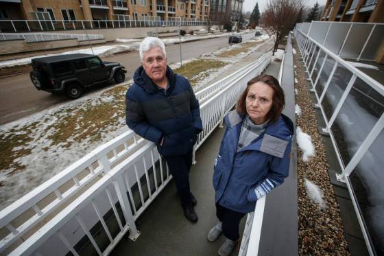 Patrick and Suzanne LeMadec had their two cars ticketed and towed from in front of their apartment. (John Woods / Winnipeg Free Press)