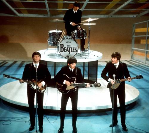 THE ASSOCIATED PRESS FILES
                                The Beatles perform on the CBS Ed Sullivan Show in New York City in 1964.