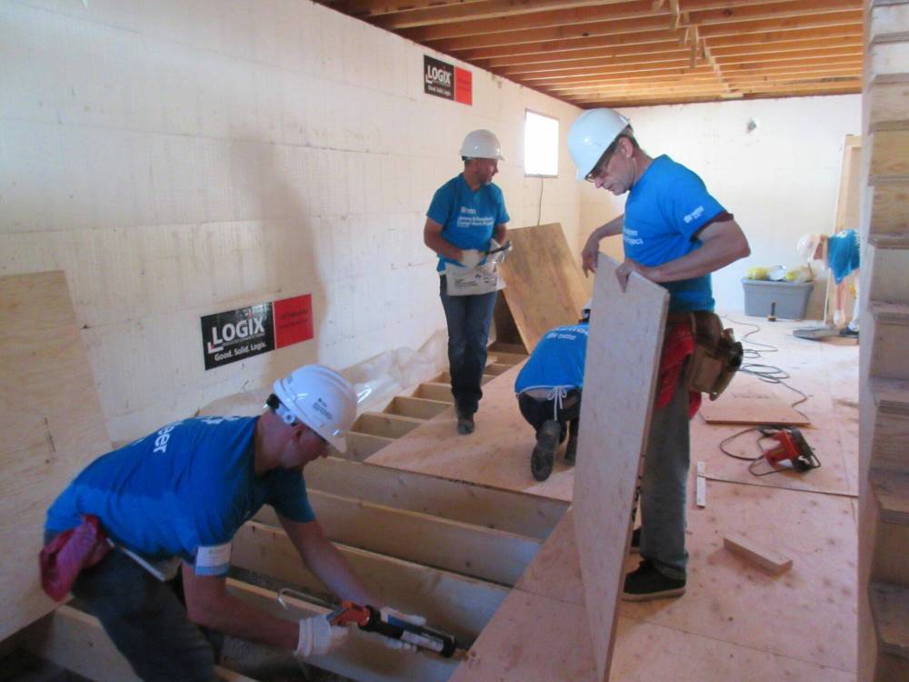 While some employees of Red River Group lend an actual hand to help Habitat for Humanity Manitoba build homes, the company has donated 10 per cent of its shares to the non-profile as a legacy gift that benefits both parties. (Supplied)
