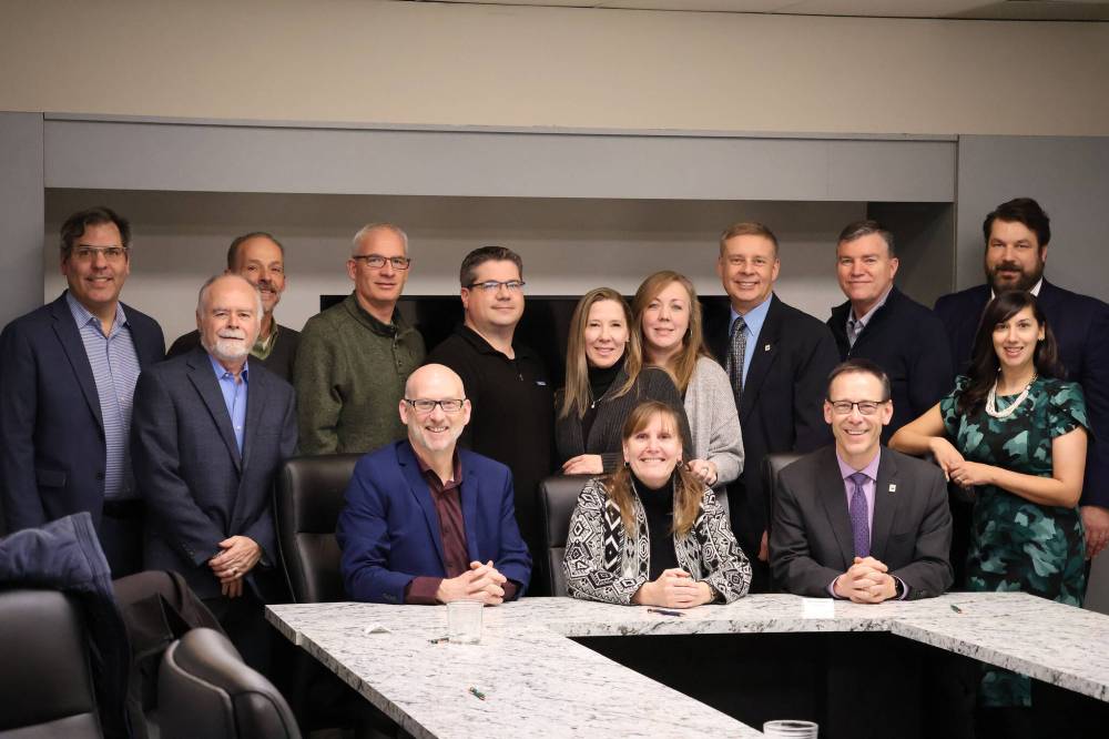 Red River Group and Habitat for Humanity Manitoba: coming together to do good together, says RRG president Gordon Daman (seated right). (Supplied)