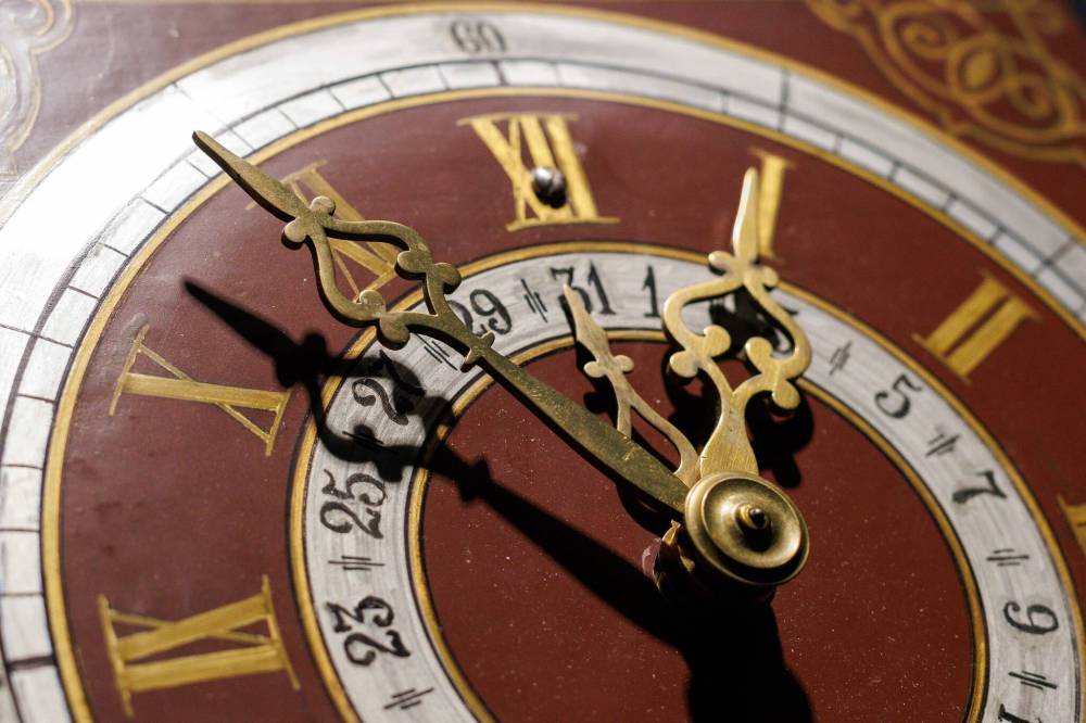 MIKE DEAL / WINNIPEG FREE PRESS
On the eve of the wedding of Anna Zacharias and Peter Schulz in 1893, the groom's father presented the couple with a Kroger clock to celebrate their marriage. The beautiful clock would become part of their family heritage for generations to follow. The couple's happiness, however, was not to last. In 1914, as war broke out in Europe, Peter died of a heart condition and left Anna a widow. In 1927, the family journeyed across the Atlantic Ocean to Canada, with the precious clock packed in their luggage, a reminder of life and family in Russia. Like Anna and Peter, Mennonite couples often received wall clocks as wedding gifts. Clocks represented a new start for young couples and symbols of prosperity and legacy as they were passed down from one generation to the next.