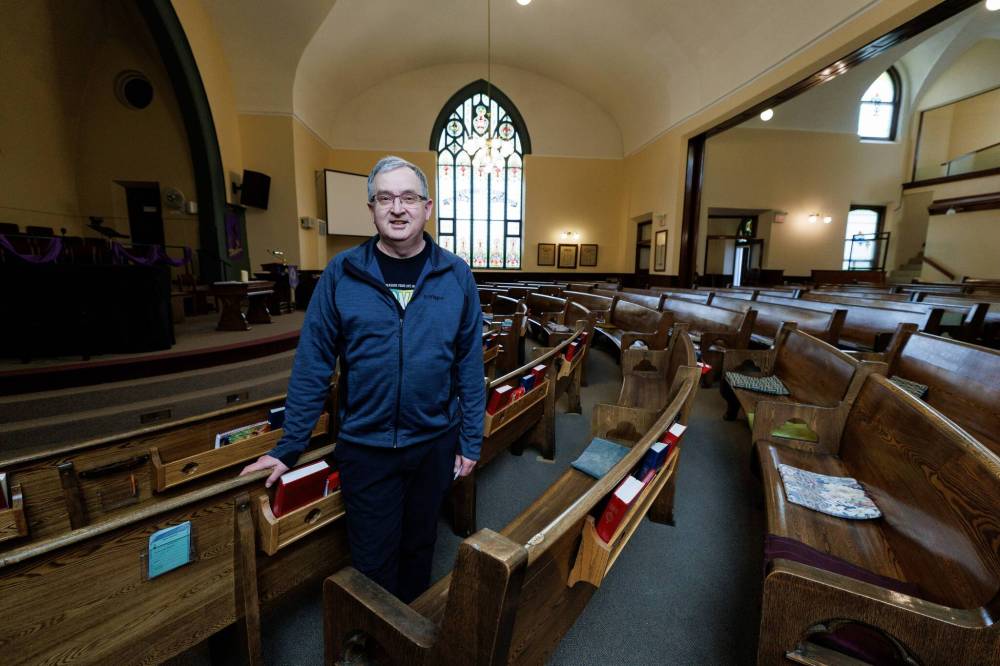 Rev. Harold Kenyon at the Carman United Church opened its doors to the community Monday, offering sanctuary for grieving residents. (Mike Deal / Winnipeg Free Press)